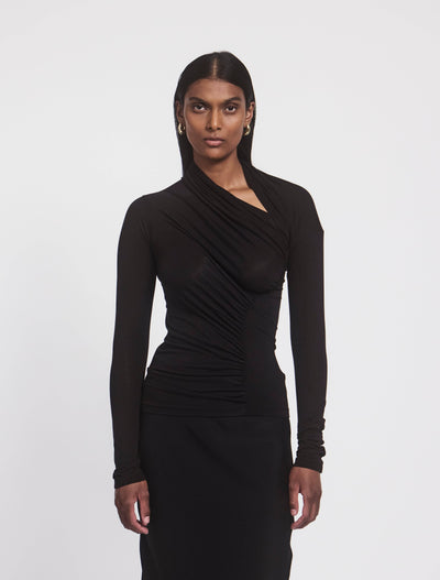 Model wearing JEANE TOP in Black, front view