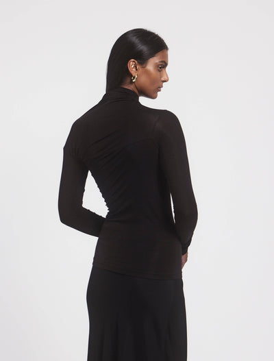 Model wearing JEANE TOP in Black, back view