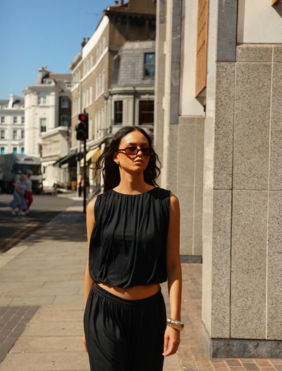 Koa Puff Ball Hem Top In Black