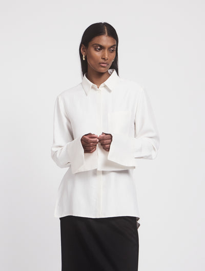 Model in Signature Luxe Shirt in White, side angle