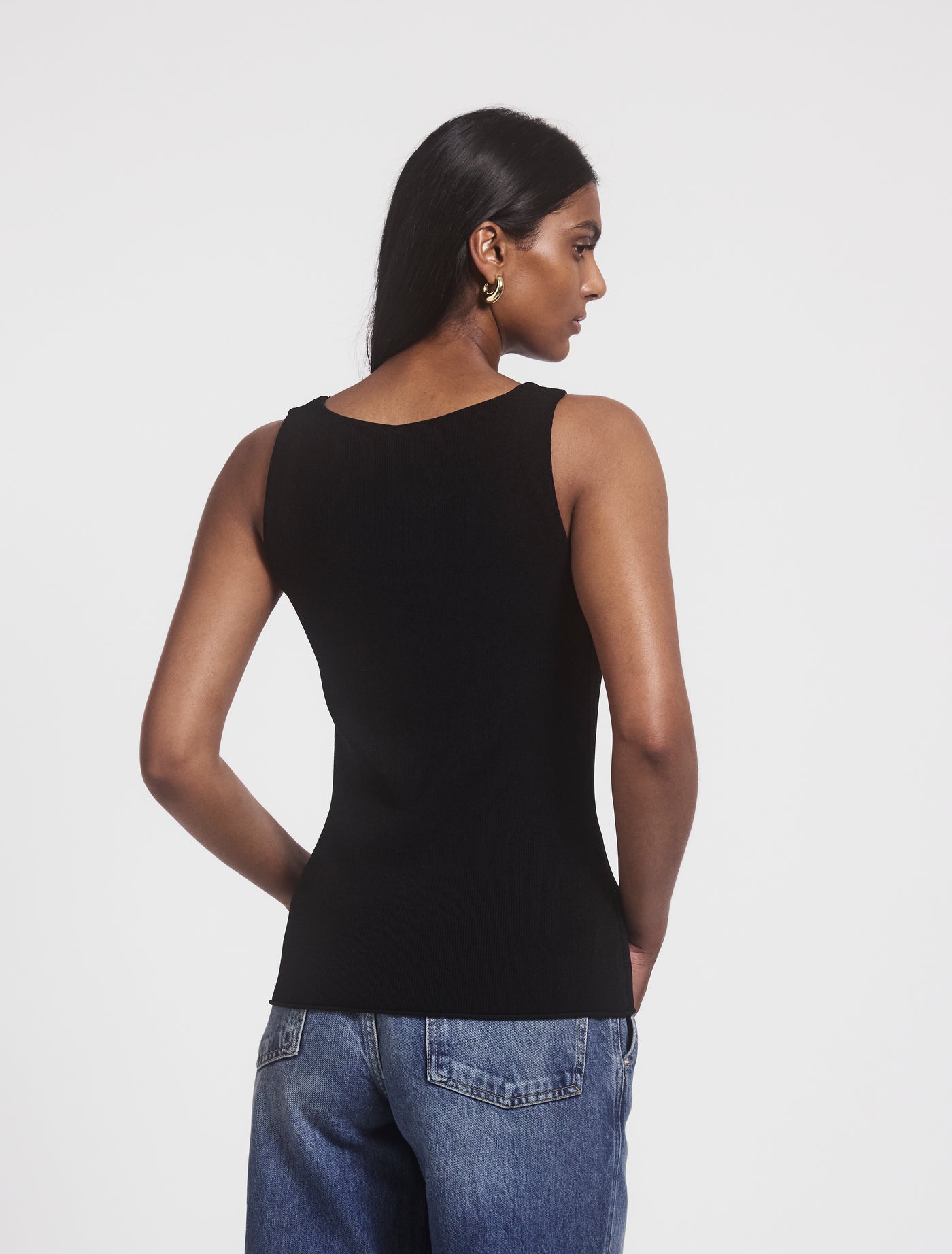 Syro Top in Black, back view on model