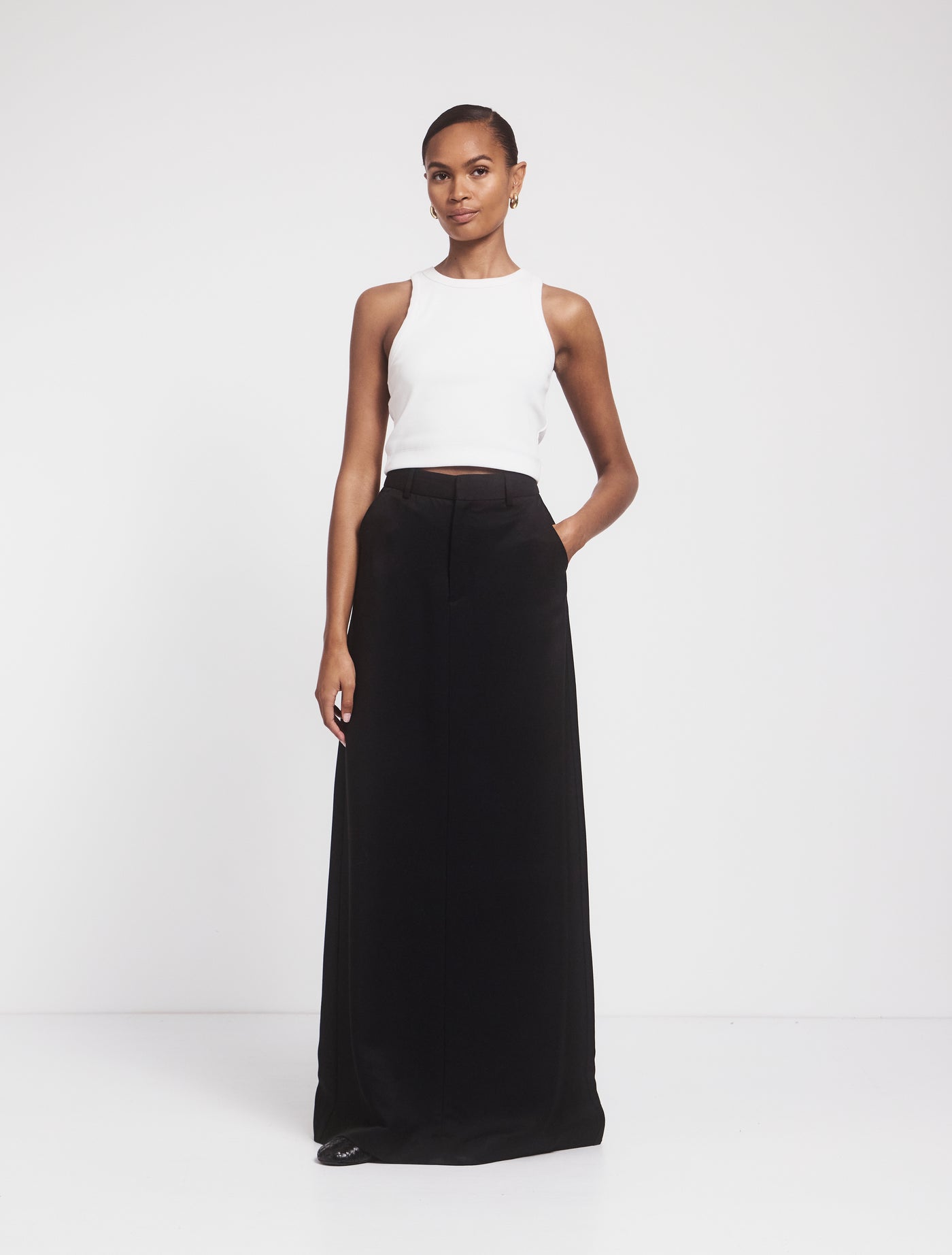 Front view of Tabby Skirt in black with white top