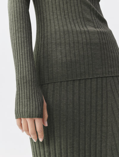 Close-up of green marl ribbed knitwear with thumb hole sleeve