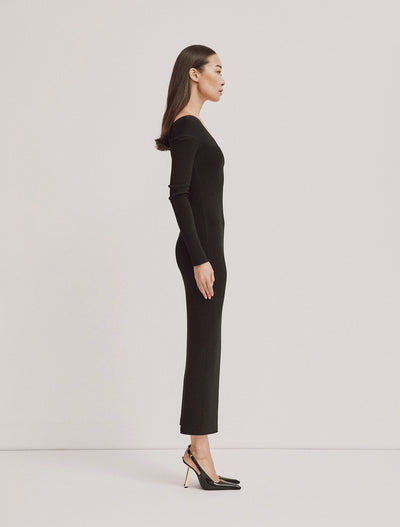 Side profile of Agia Dress in Black, sleek silhouette