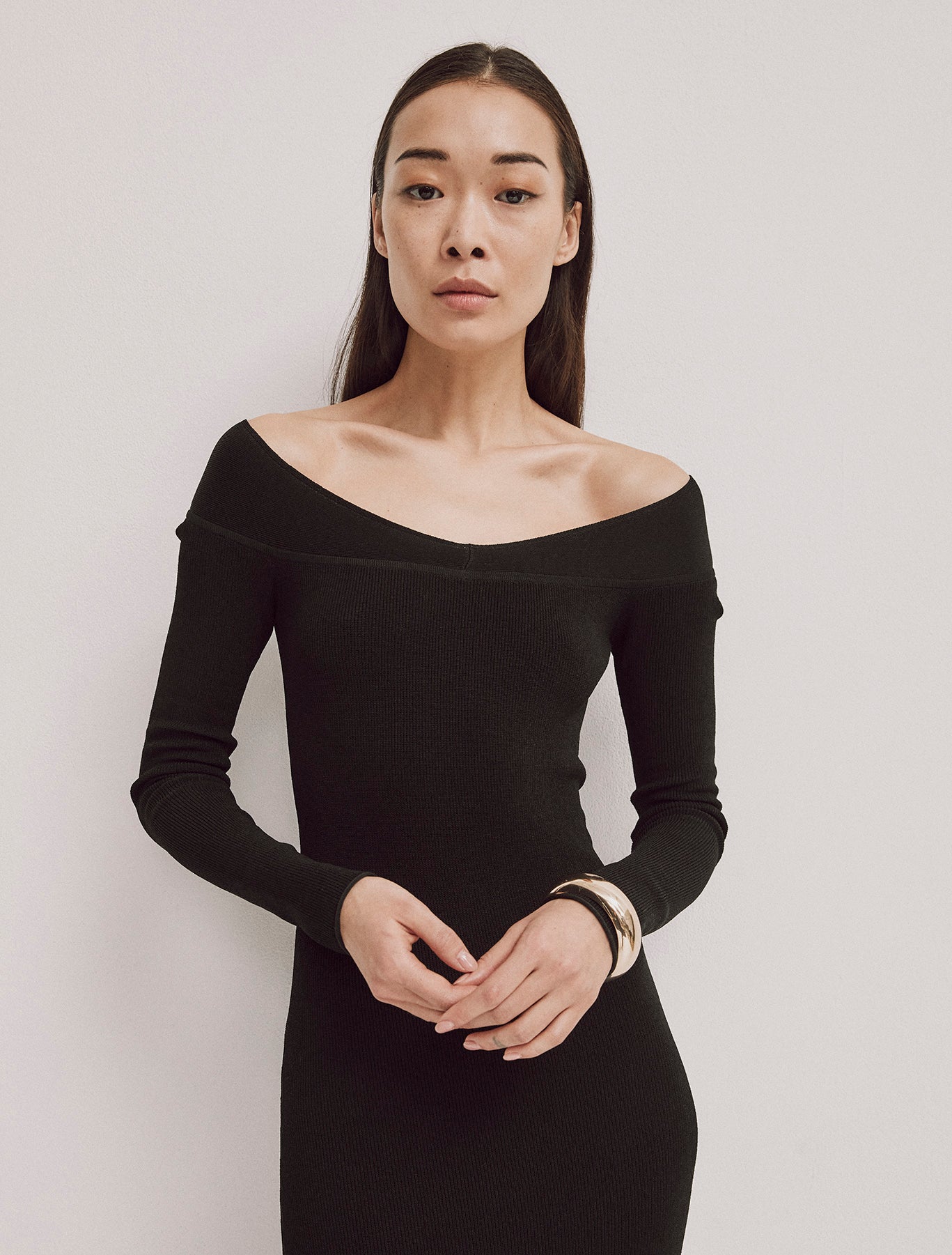 Close-up of Agia Dress in Black, off-shoulder design