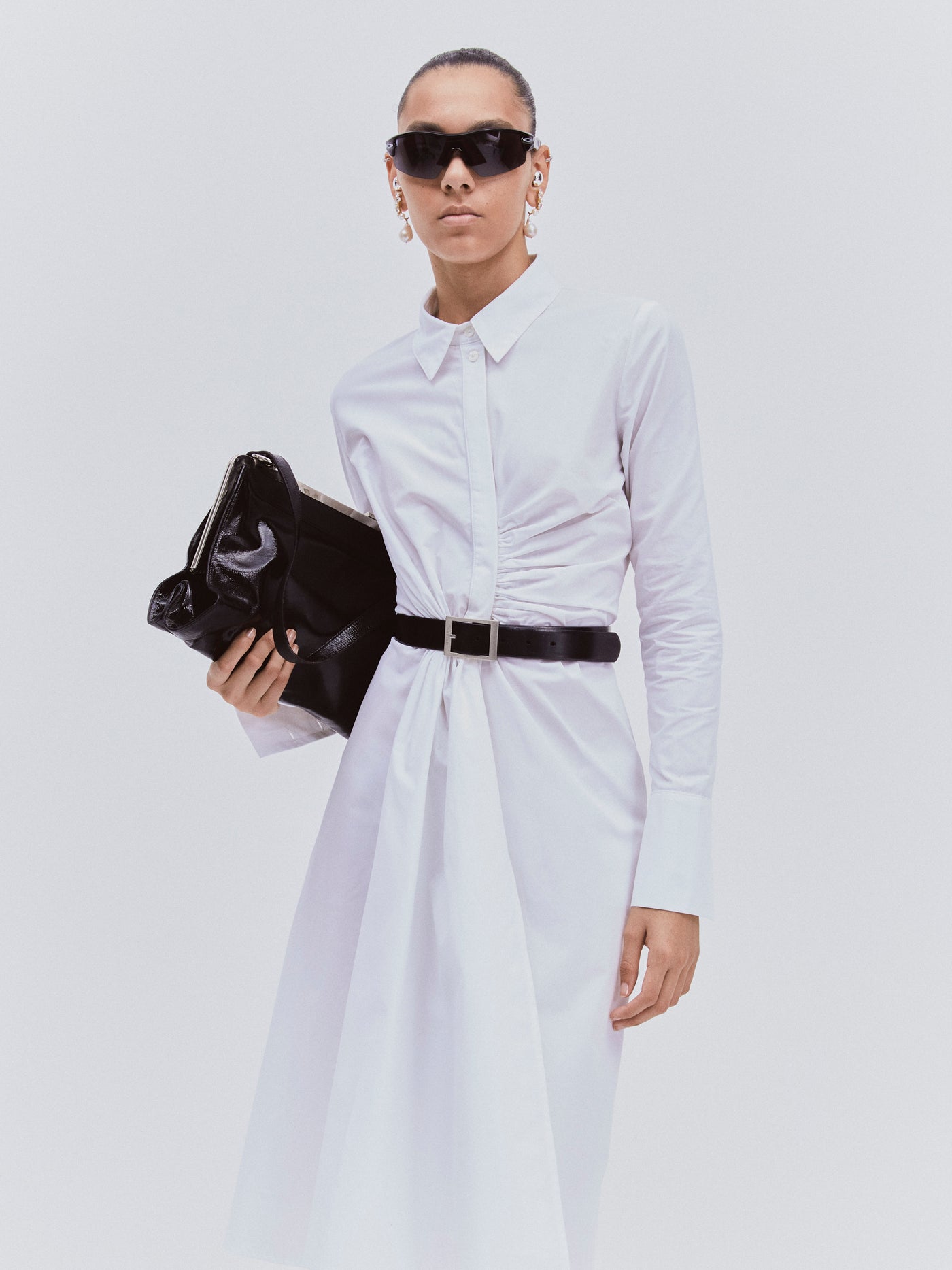 Close-up of Ophelia Shirtdress in white with black accessories